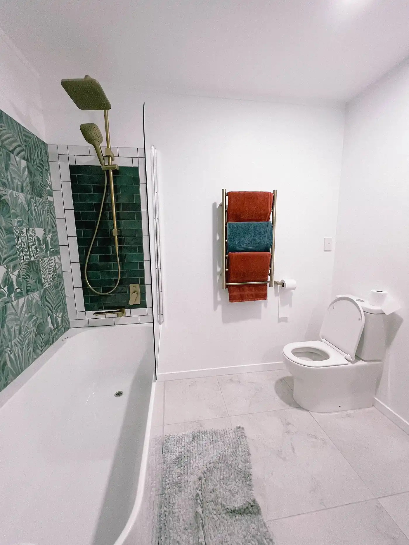 Compact bathroom after renovation with new tiles, fittings and a clean finish