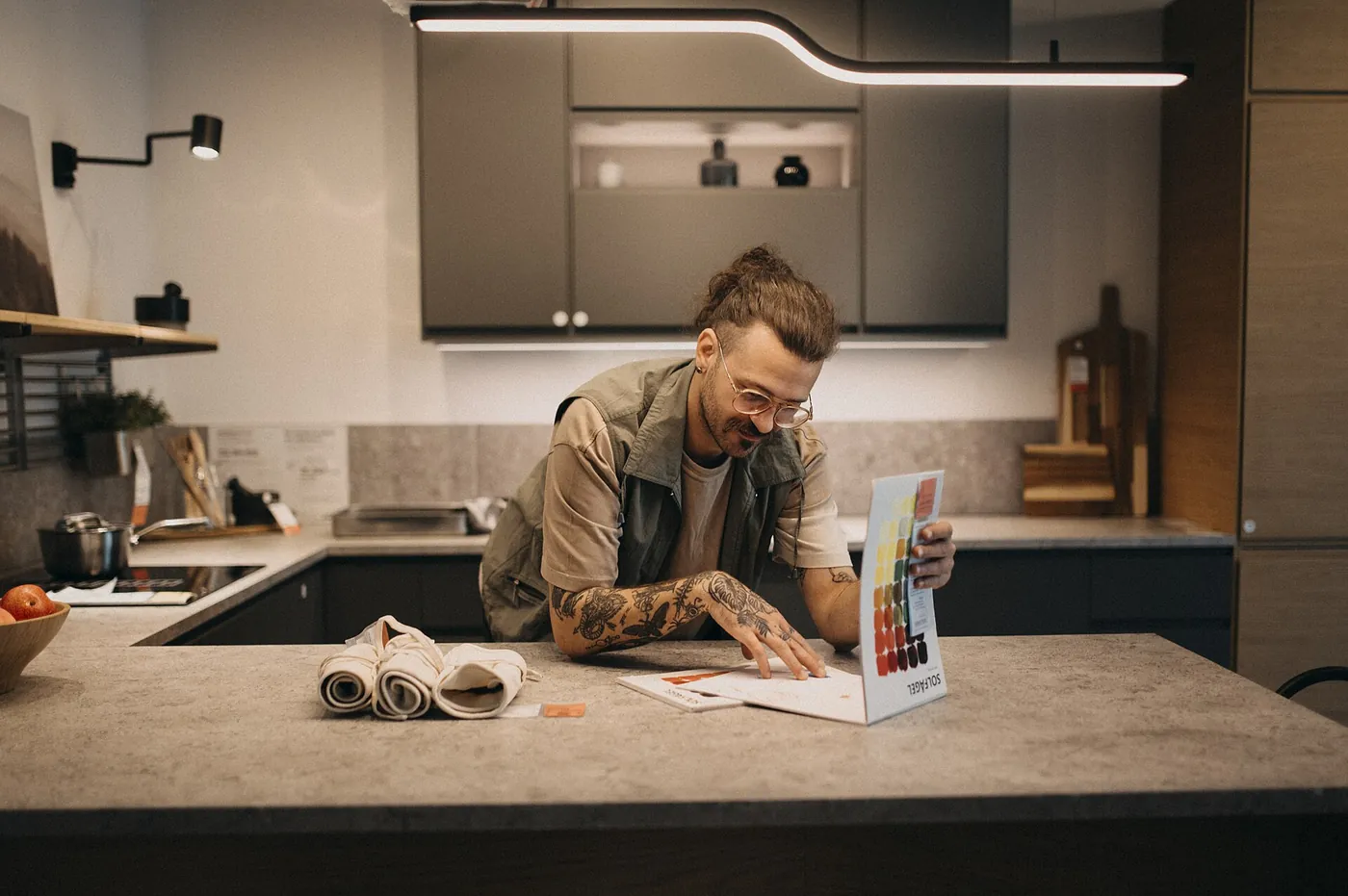Reviewing colour samples and kitchen design options at a kitchen counter