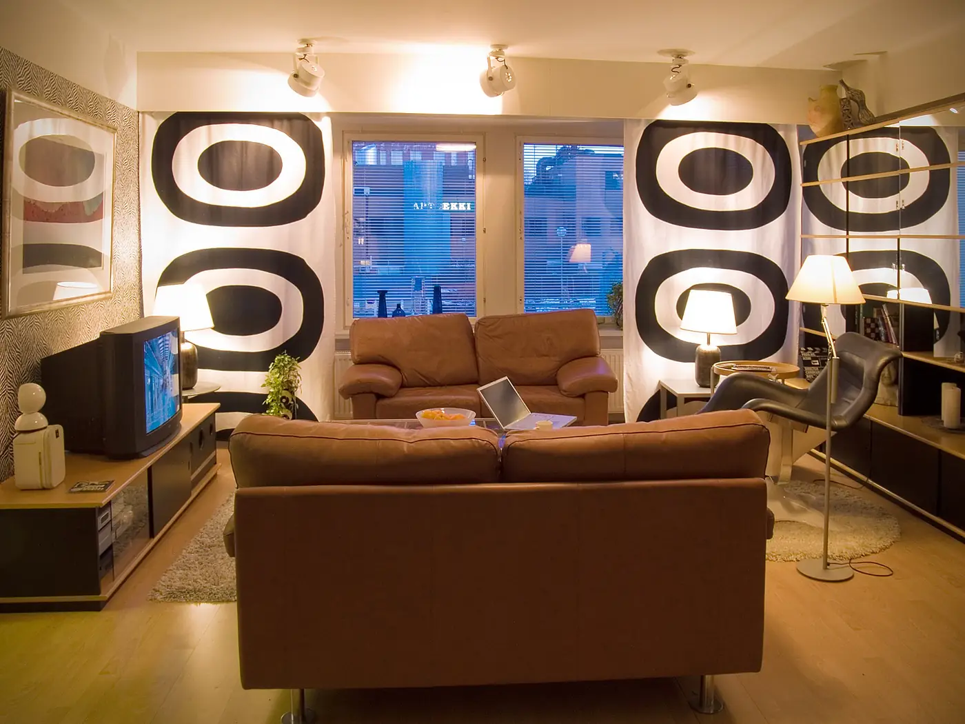 Living room with dated furniture and decor awaiting renovation